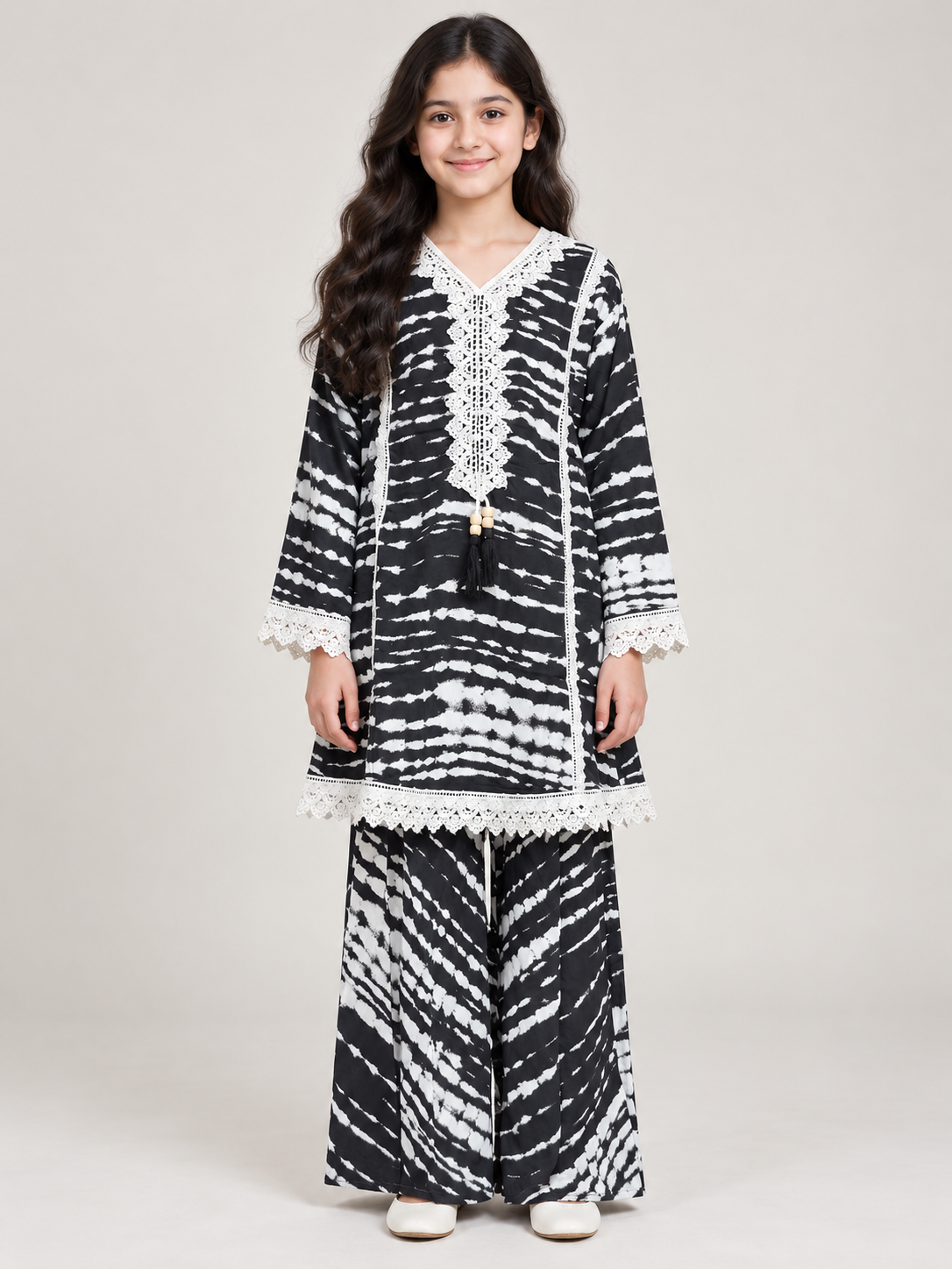 Front view of the black and white printed cotton plazo set with lace trim