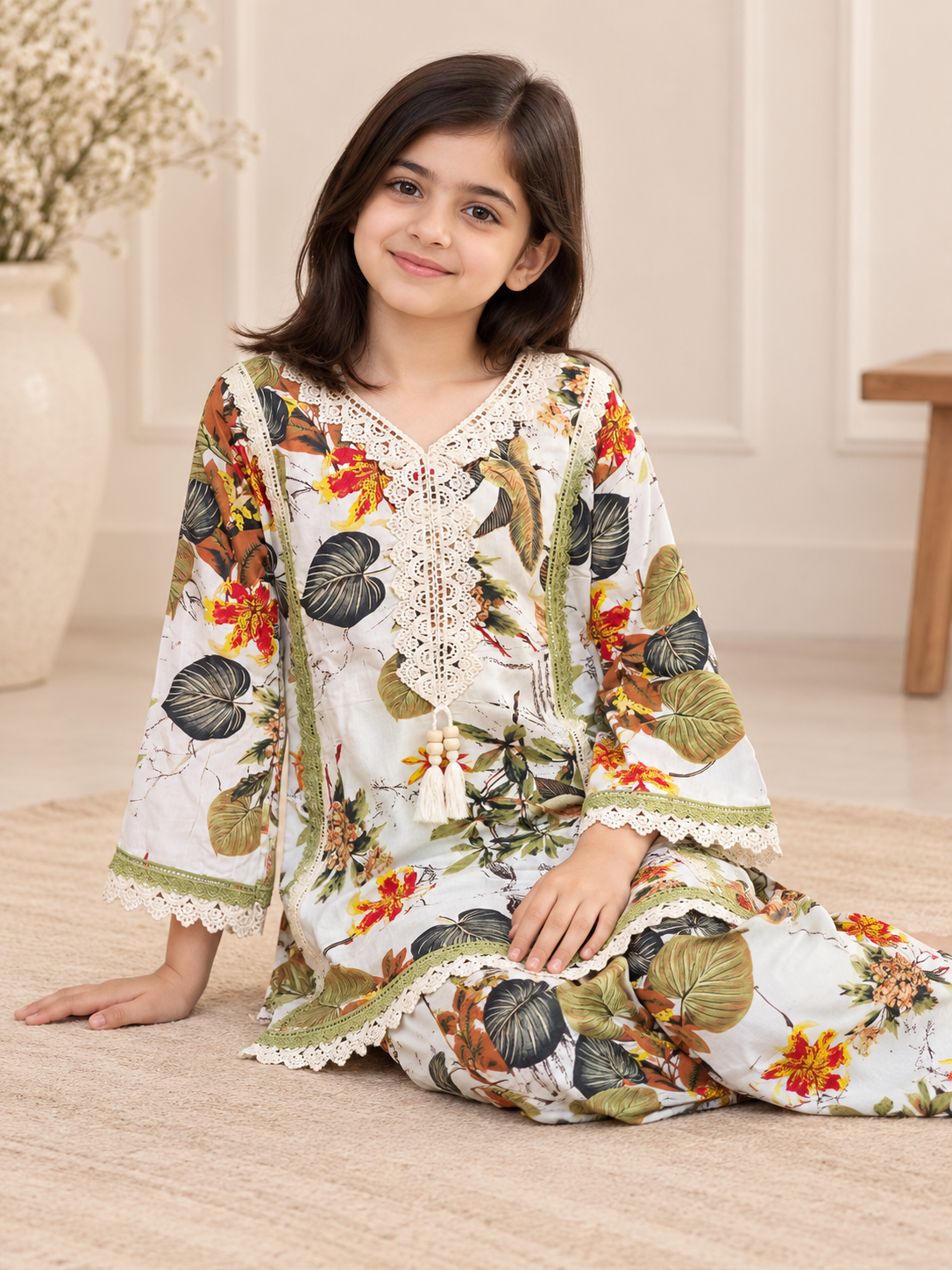 Side view of a cream floral cotton plazo set with coordinated bottoms