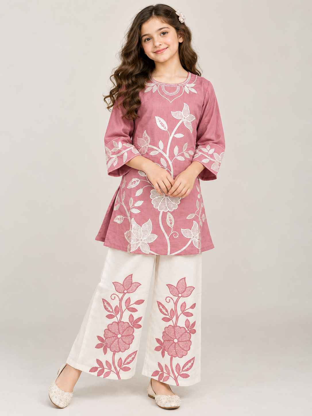 Front view of the pink cotton embroidery kurti set on a model
