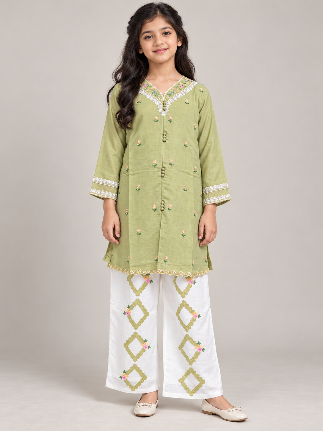 Front view of the green cotton embroidery kurti set on a model